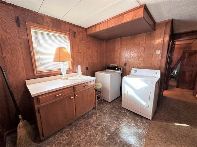 542 Volunteer Rd, Fancy Gap, VA 24328 - laundry room with washing machine and dryer, wood walls, and cabinet space