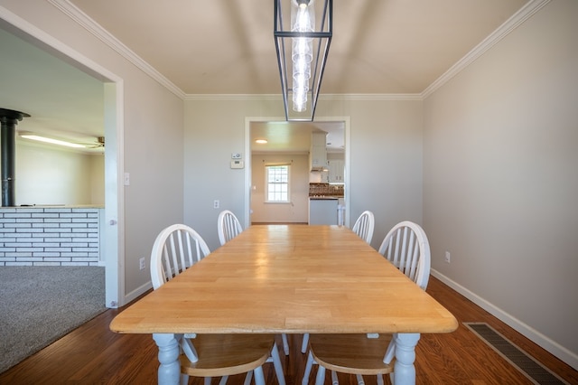8214 Snake Creek Rd, Hillsville, VA 24343 - dining space featuring dark wood-style floors, ornamental molding, and a ceiling fan