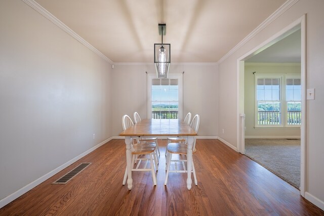 8214 Snake Creek Rd, Hillsville, VA 24343 - dining space with wood finished floors and crown molding