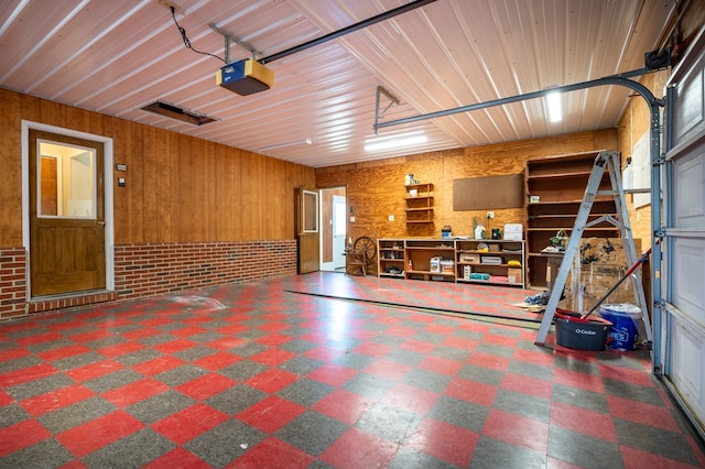8214 Snake Creek Rd, Hillsville, VA 24343 - garage featuring a garage door opener and wooden walls