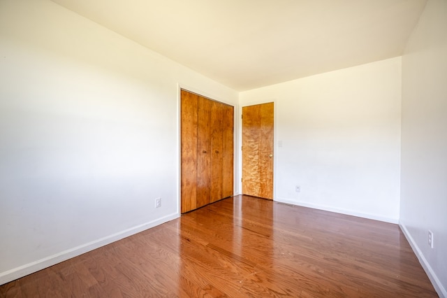 8214 Snake Creek Rd, Hillsville, VA 24343 - empty room featuring wood finished floors and baseboards