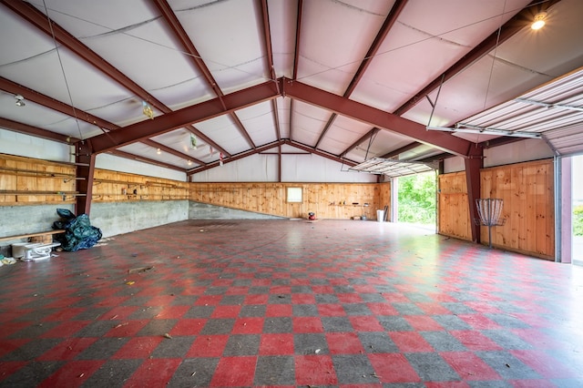 8214 Snake Creek Rd, Hillsville, VA 24343 - misc room with wooden walls, vaulted ceiling, and a garage