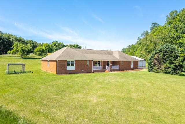 8214 Snake Creek Rd, Hillsville, VA 24343 - rear view of house featuring covered porch, a yard, brick siding, and a garage