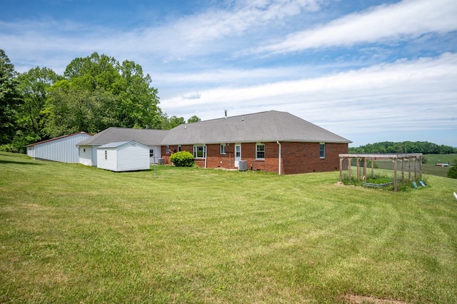8214 Snake Creek Rd, Hillsville, VA 24343 - rear view of property with brick siding and a yard