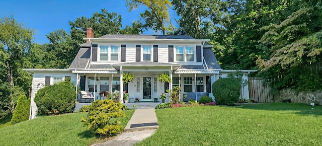 view of front of home featuring a porch and a front yard