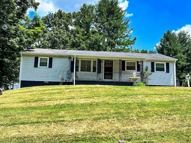 view of front of home featuring covered porch and a front lawn