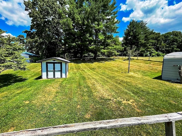 view of yard with an outbuilding and a storage unit