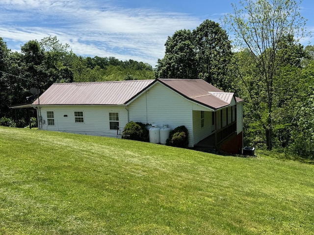 318 Limestone Rd, Pounding Mill, VA 24637 - view of home's exterior featuring a lawn and metal roof