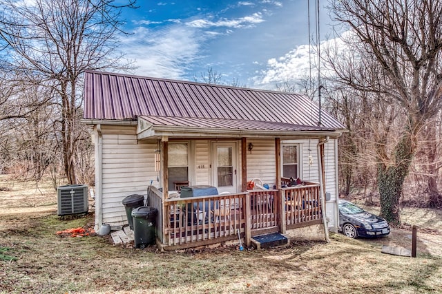 rear view of house with central air condition unit