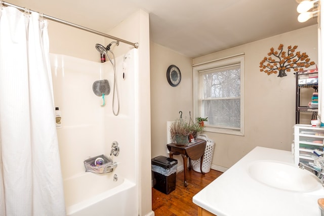 bathroom with shower / bathtub combination with curtain, vanity, and hardwood / wood-style flooring