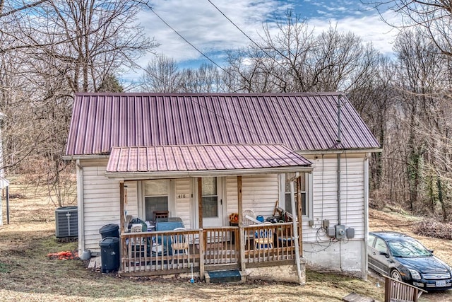 view of front of property with covered porch and central air condition unit