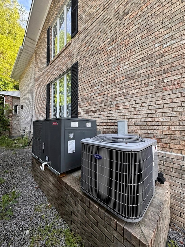1595 Edgewater Dr, Grundy, VA 24614 - exterior view of central AC unit and brick siding