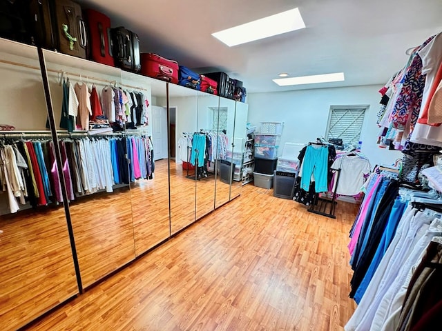 1595 Edgewater Dr, Grundy, VA 24614 - walk in closet featuring a skylight and wood finished floors