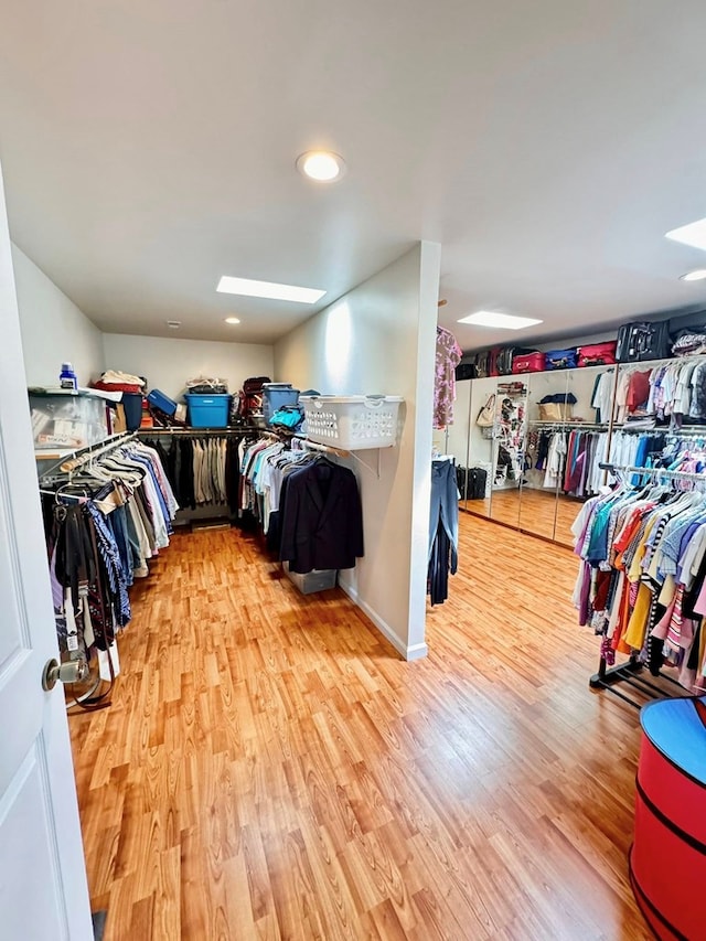1595 Edgewater Dr, Grundy, VA 24614 - spacious closet with a skylight and wood finished floors