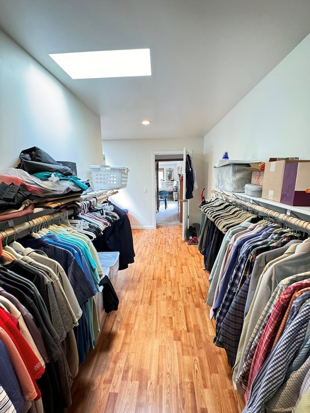 1595 Edgewater Dr, Grundy, VA 24614 - spacious closet with a skylight and light wood-style flooring