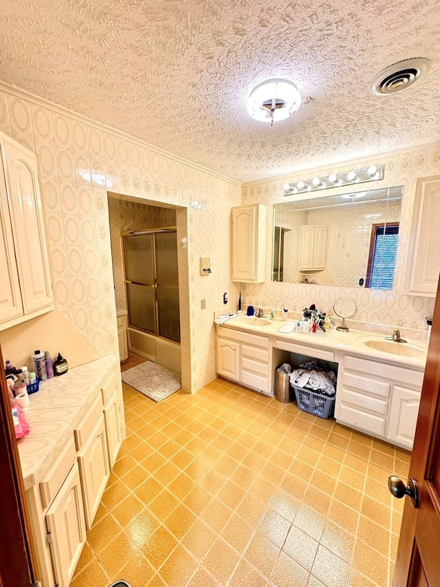 1595 Edgewater Dr, Grundy, VA 24614 - full bath with ornamental molding, a shower with door, a textured ceiling, double vanity, and wallpapered walls