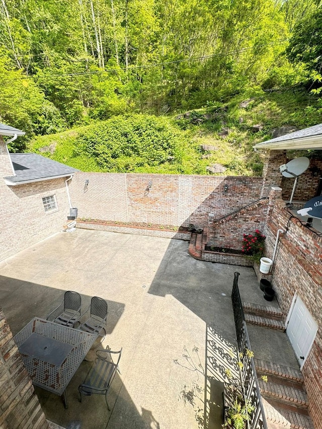 1595 Edgewater Dr, Grundy, VA 24614 - view of patio / terrace featuring a forest view