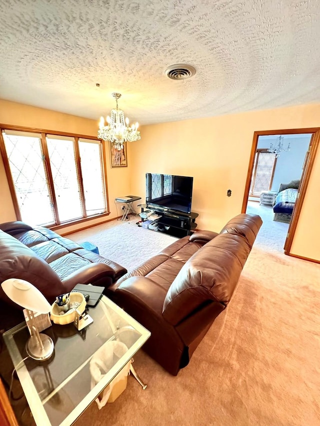 1595 Edgewater Dr, Grundy, VA 24614 - carpeted living room featuring a textured ceiling, a chandelier, and healthy amount of natural light