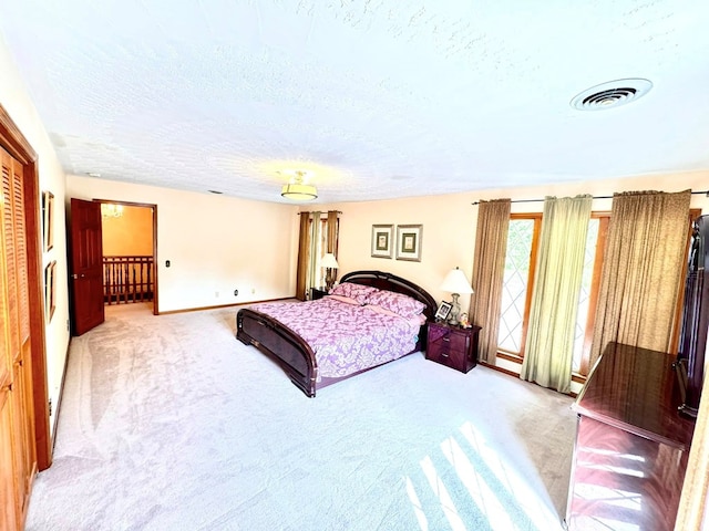 1595 Edgewater Dr, Grundy, VA 24614 - bedroom featuring light colored carpet, a textured ceiling, and baseboards