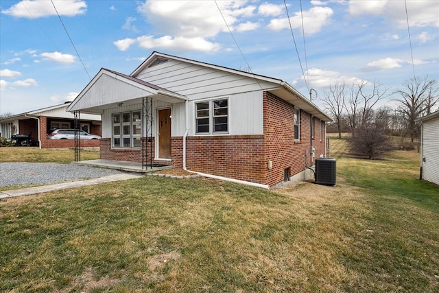 409 Crescent Dr, Glade Spring, VA 24340 - bungalow with brick siding, a front lawn, and central AC
