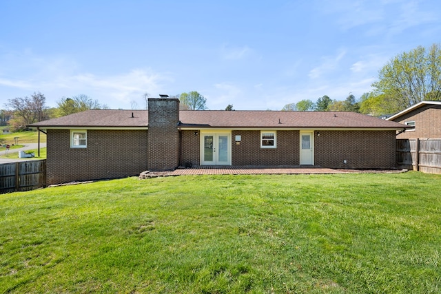 7268 Southern View Rd, Bristol, VA 24202 - back of house with fence, french doors, a chimney, and a lawn