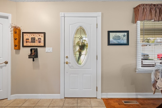 7268 Southern View Rd, Bristol, VA 24202 - entrance foyer with light tile patterned flooring, baseboards, and visible vents
