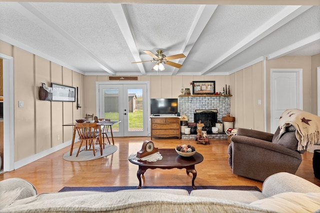 7268 Southern View Rd, Bristol, VA 24202 - living area featuring ceiling fan, a textured ceiling, light wood-type flooring, and beam ceiling