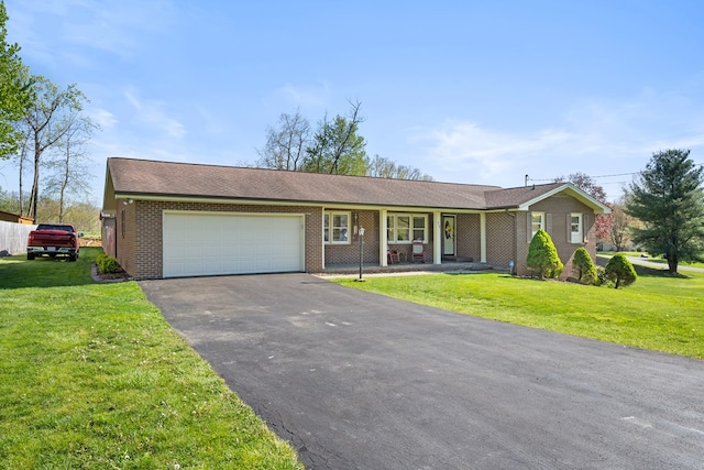7268 Southern View Rd, Bristol, VA 24202 - single story home featuring a porch, an attached garage, brick siding, driveway, and a front lawn