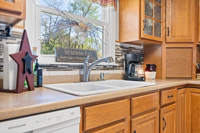7268 Southern View Rd, Bristol, VA 24202 - kitchen featuring light countertops, glass insert cabinets, a sink, dishwasher, and tasteful backsplash