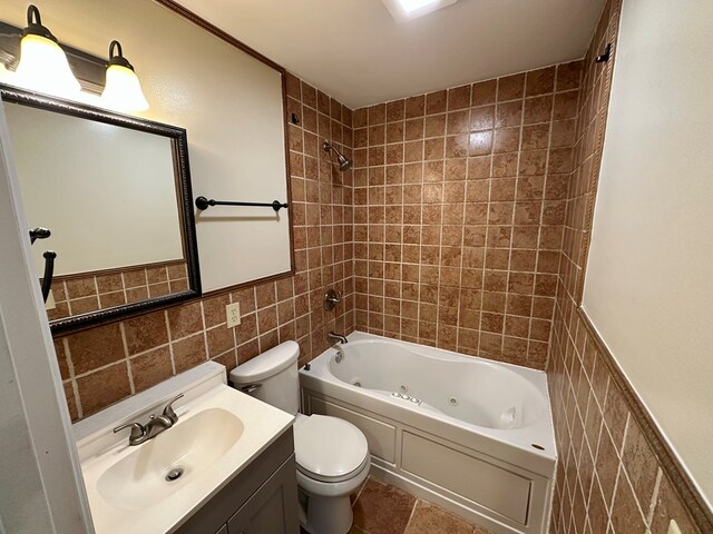 23677 Archery Range Rd, Bristol, VA 24202 - full bath featuring tile walls, a combined bath / shower with jetted tub, vanity, and wainscoting