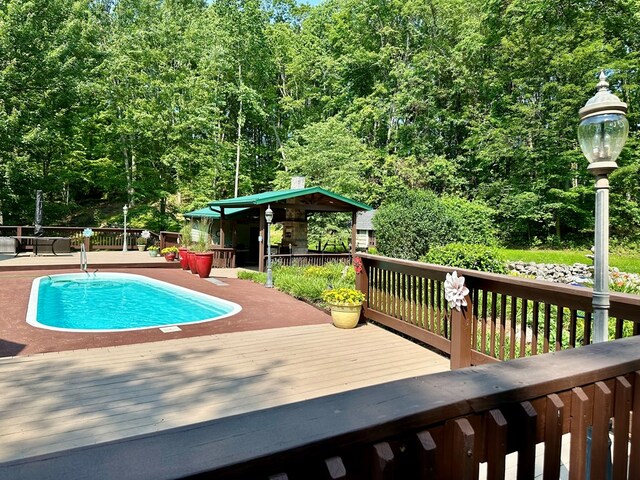23677 Archery Range Rd, Bristol, VA 24202 - view of swimming pool featuring a wooden deck and a forest view
