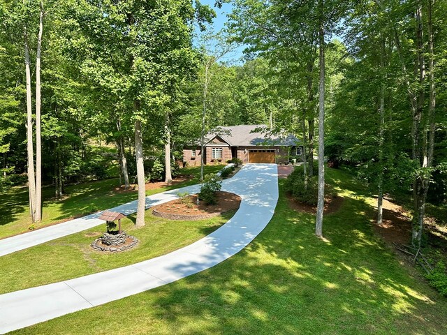 23677 Archery Range Rd, Bristol, VA 24202 - view of front of house with a front lawn and a forest view