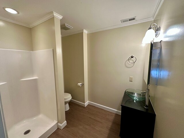 23677 Archery Range Rd, Bristol, VA 24202 - bathroom featuring ornamental molding, wood finished floors, vanity, and a stall shower