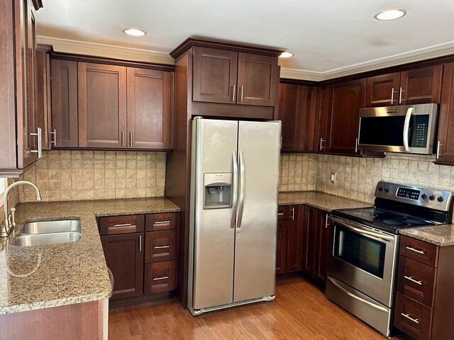 23677 Archery Range Rd, Bristol, VA 24202 - kitchen featuring stainless steel appliances, light stone countertops, decorative backsplash, recessed lighting, and crown molding