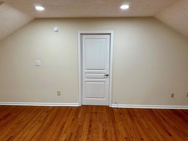 23677 Archery Range Rd, Bristol, VA 24202 - additional living space with lofted ceiling, a textured ceiling, wood finished floors, and recessed lighting