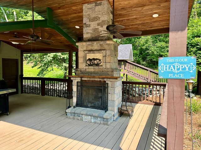 23677 Archery Range Rd, Bristol, VA 24202 - deck with an outdoor stone fireplace and a ceiling fan