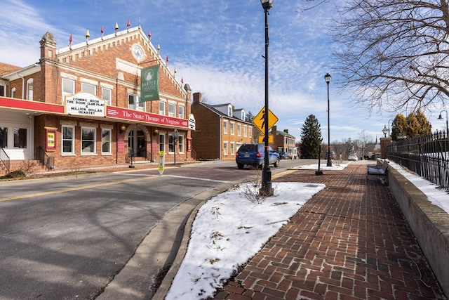 view of street featuring street lighting, curbs, and sidewalks