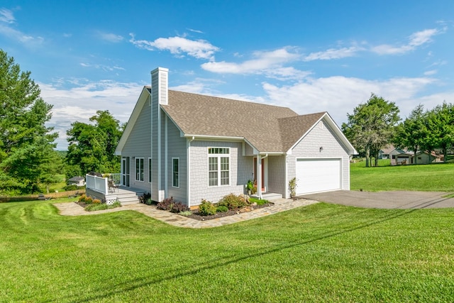 view of front of home featuring a garage and a front yard