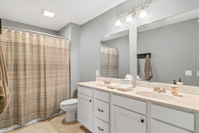 bathroom with walk in shower, tile patterned floors, toilet, and vanity