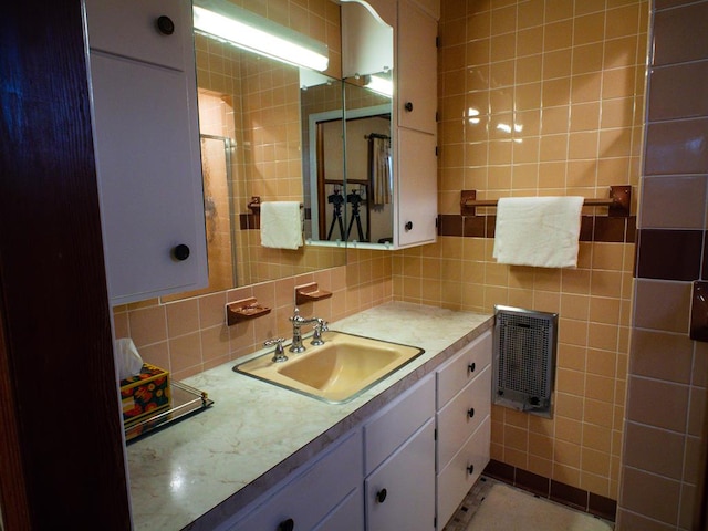 3878 Blue Grass Trl, Saltville, VA 24370 - bathroom with vanity, decorative backsplash, and tile walls