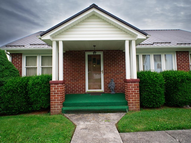 3878 Blue Grass Trl, Saltville, VA 24370 - view of front of property featuring brick siding, a standing seam roof, and a metal roof