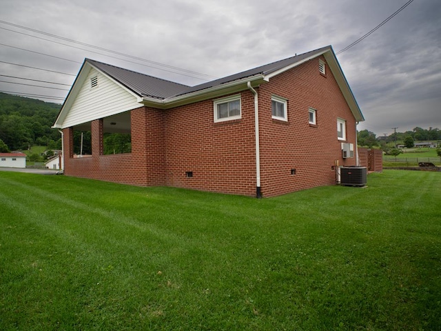 3878 Blue Grass Trl, Saltville, VA 24370 - view of side of property featuring brick siding, a lawn, and a metal roof