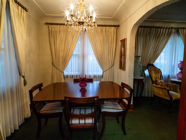 3878 Blue Grass Trl, Saltville, VA 24370 - dining room featuring arched walkways, a chandelier, and carpet flooring