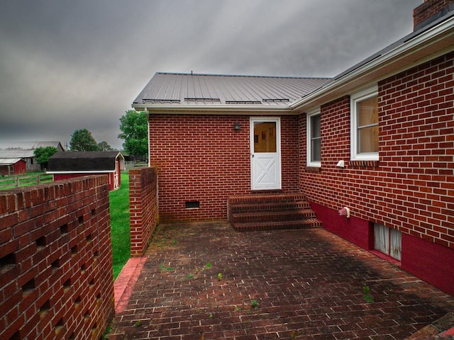 3878 Blue Grass Trl, Saltville, VA 24370 - view of home's exterior featuring brick siding, a metal roof, and crawl space