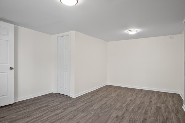 basement with wood finished floors and baseboards