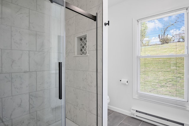 bathroom featuring baseboard heating, a stall shower, tile patterned flooring, toilet, and baseboards