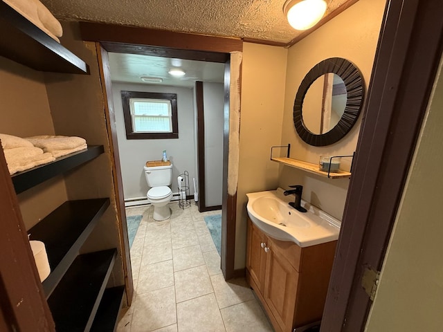 108 Square St, Bluefield, VA 24605 - bathroom with toilet, vanity, and tile patterned floors