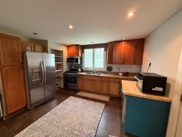 108 Square St, Bluefield, VA 24605 - kitchen featuring appliances with stainless steel finishes, a sink, butcher block countertops, recessed lighting, and brown cabinets