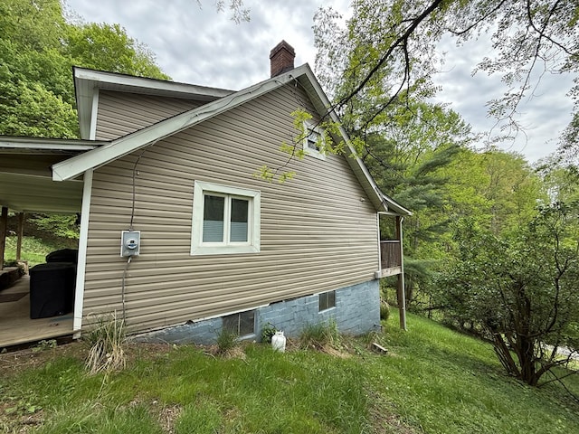 108 Square St, Bluefield, VA 24605 - view of side of home with a chimney, a deck, and a lawn