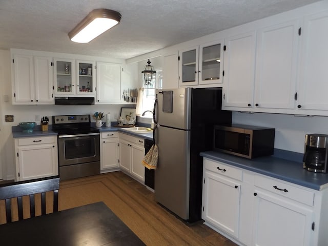 304 Edgewood Dr, Galax, VA 24333 - kitchen featuring appliances with stainless steel finishes, extractor fan, white cabinetry, and a sink